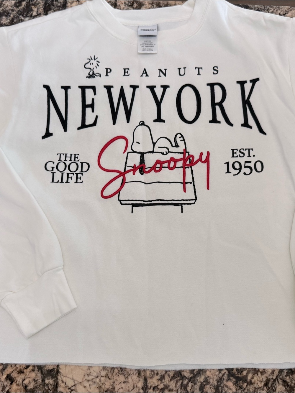 Peanuts White Crewneck Sweater with Black and Red Snoopy Graphic